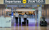Travelers head to the departure area at Ben Gurion Airport on August 17, 2020. (Olivier Fitoussi/Flash90)