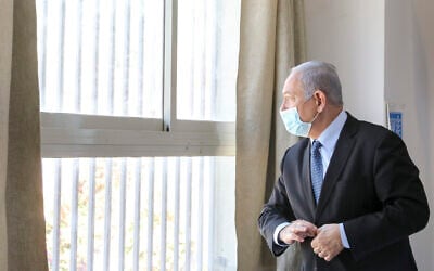 Prime Minister Benjamin Netanyahu visits a school in Jerusalem ahead of the opening of the school year, August 25, 2020. (Marc Israel Sellem/Pool)