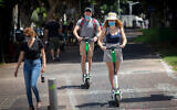 Israelis wear protective face masks in Tel Aviv, on August 26, 2020. (Miriam Alster/Flash90)