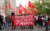 Illustrative: Members of the Democratic Socialists of America gather outside of a Trump-owned building on May Day on May 01, 2019 in New York City. (Photo by Spencer Platt/Getty Images via JTA)