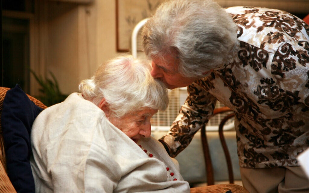 Marion House embracing Gaby Glueckselig. Born in Berlin in 1923, Marion now is one of the oldest members of the Stammtisch. She was saved from the Holocaust through the Kindertrasnport, which brought her to live in London for a few years. (Courtesy Shani Bar On/ from 'Almost a Ritual' by Emil Rennert)