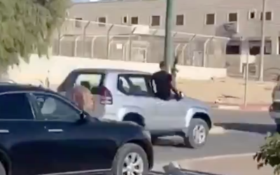 A convoy rides through the southern town of Segev Shalom with its passengers firing automatic weapons into the air, in footage released by Channel 13 on August 1, 2020. (Screen capture/Twitter)