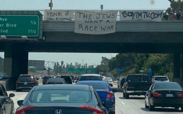 A sign reading 'The Jews want a race war' is seen on a highway overpass in Los Angeles. (Siamak Kordestani/Twitter via JTA) A sign reading 'The Jews want a race war' is seen on a highway overpass in Los Angeles. (Siamak Kordestani/Twitter via JTA)