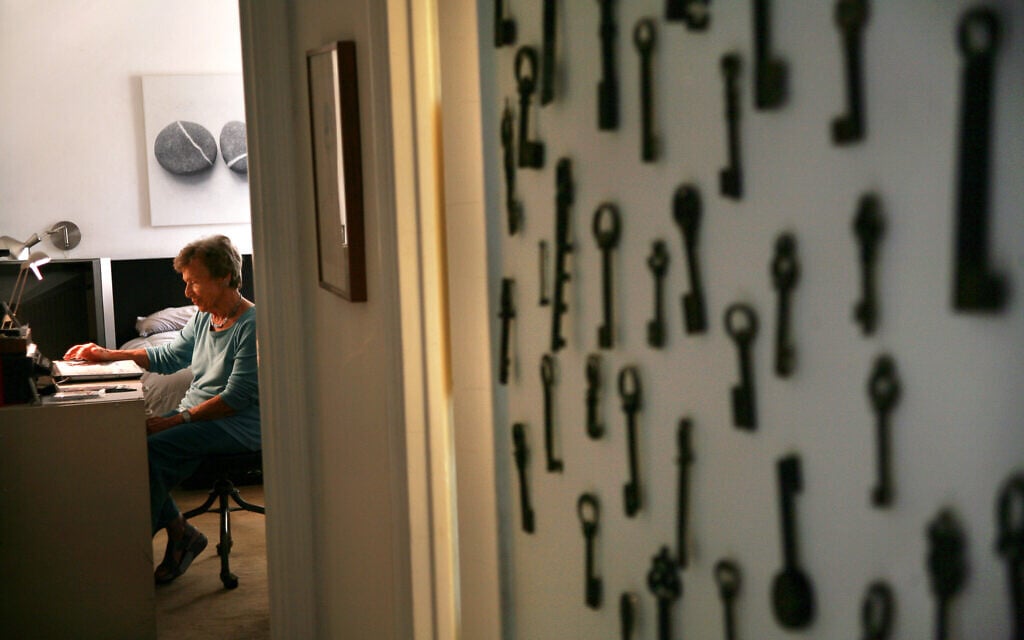Trudy Jeremias, hostess of the Stammtisch since 2015, seen in her Upper East Side apartment with the 14th century key collection of her uncle, who perished in the Holocaust.
(Courtesy Shani Bar On/ from 'Almost a Ritual' by Emil Rennert)