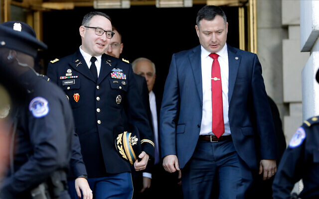 Then National Security Council aide Lt. Col. Alexander Vindman, left, walks with his twin brother, Army Lt. Col. Yevgeny Vindman, right, after testifying before the House Intelligence Committee on Capitol Hill in Washington, during a public impeachment hearing of US President Donald Trump's efforts to tie US aid for Ukraine to investigations of his political opponents, November 19, 2019. (AP Photo/Julio Cortez, File) Then National Security Council aide Lt. Col. Alexander Vindman, left, walks with his twin brother, Army Lt. Col. Yevgeny Vindman, right, after testifying before the House Intelligence Committee on Capitol Hill in Washington, during a public impeachment hearing of US President Donald Trump's efforts to tie US aid for Ukraine to investigations of his political opponents, November 19, 2019. (AP Photo/Julio Cortez, File)