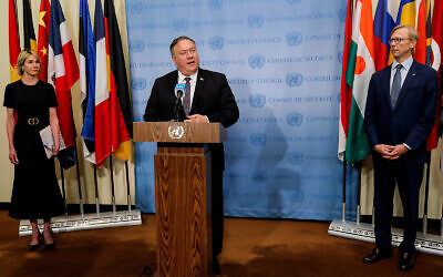 US Secretary of State Mike Pompeo speaks to reporters following a meeting with members of the UN Security Council, with US Ambassador to the UN Kelly Craft, left, and US Special Representative for Iran Brian Hook, right, at the United Nations, August 20, 2020. (Mike Segar/Pool via AP)
