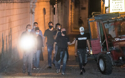 One of the officers who was involved in the killing of Iyad Halak is seen with investigators during a reconstruction of the incident in Jerusalem, August 26, 2020. (Yonatan Sindel/Flash90)