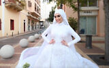 Dr. Israa Seblani during her wedding photo shoot moments before the Beirut blast tore through the city. (Screenshot/Mahmoud Nakib via AFP)