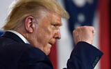US President Donald Trump pumps his fist as he finishes speaking during an event at the Whirlpool Corporation facility in Clyde, Ohio, August 6, 2020. (AP Photo/Susan Walsh)