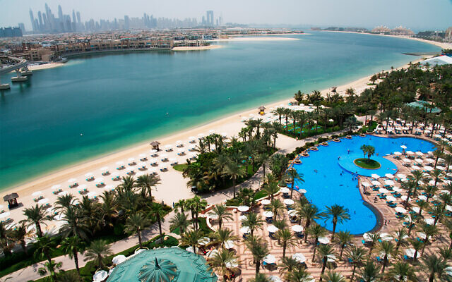 The pool and beach at the Atlantis Hotel with the skyline of the Dubai Marina visible in the distance in Dubai, United Arab Emirates, July 14, 2020. (AP Photo/Jon Gambrell) The pool and beach at the Atlantis Hotel with the skyline of the Dubai Marina visible in the distance in Dubai, United Arab Emirates, July 14, 2020. (AP Photo/Jon Gambrell)