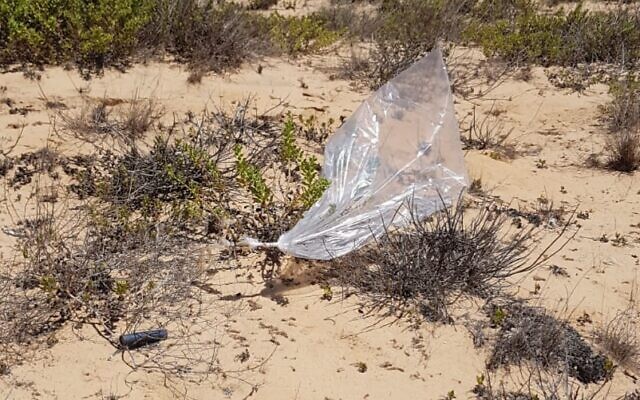 A suspected balloon-borne explosive device lands outside a community in the Hof Ashkelon region of southern Israel on August 24, 2020. (Israel Police) A suspected balloon-borne explosive device lands outside a community in the Hof Ashkelon region of southern Israel on August 24, 2020. (Israel Police)