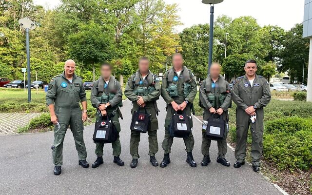 Israeli Air Force commander Amikam Norkin, right, German Air Force Commander Ingo Gerhartz, left, and five IAF pilots pose for a photograph before taking part in a flyby over Munich and the Dachau concentration camp on August 18, 2020. (Israel Defense Forces)