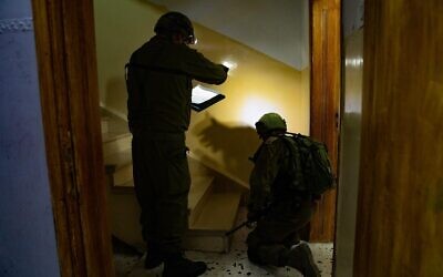 Israeli troops in the northern West Bank village of Rujeeb measure the home of a suspected Palestinian terrorist who allegedly stabbed to death an Israeli man the day before, on August 27, 2020. (Israel Defense Forces)