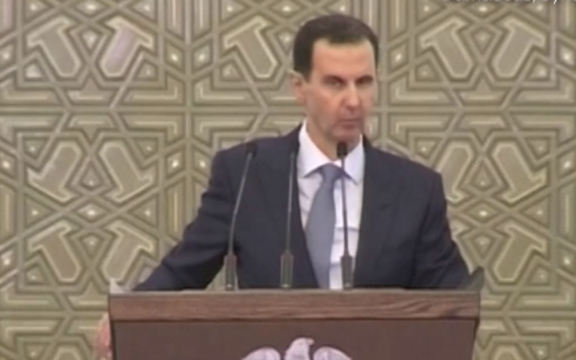 Syrian President Bashar Assad appears weak and tired during a speech to parliament which was interrupted due to a 'drop in blood pressure,' August 12, 2020. (Screen capture: YouTube) Syrian President Bashar Assad appears weak and tired during a speech to parliament which was interrupted due to a 'drop in blood pressure,' August 12, 2020. (Screen capture: YouTube)
