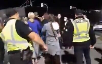Police intervene as local residents try and stop Hassidic pilgrims entering into the town of Uman, Ukraine (Screencapture/Kan)