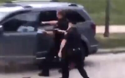 Police officer fires multiple shots at a Black man in Kenosha, Wisconsin, August 23, 2020 (Screen grab/Twitter)