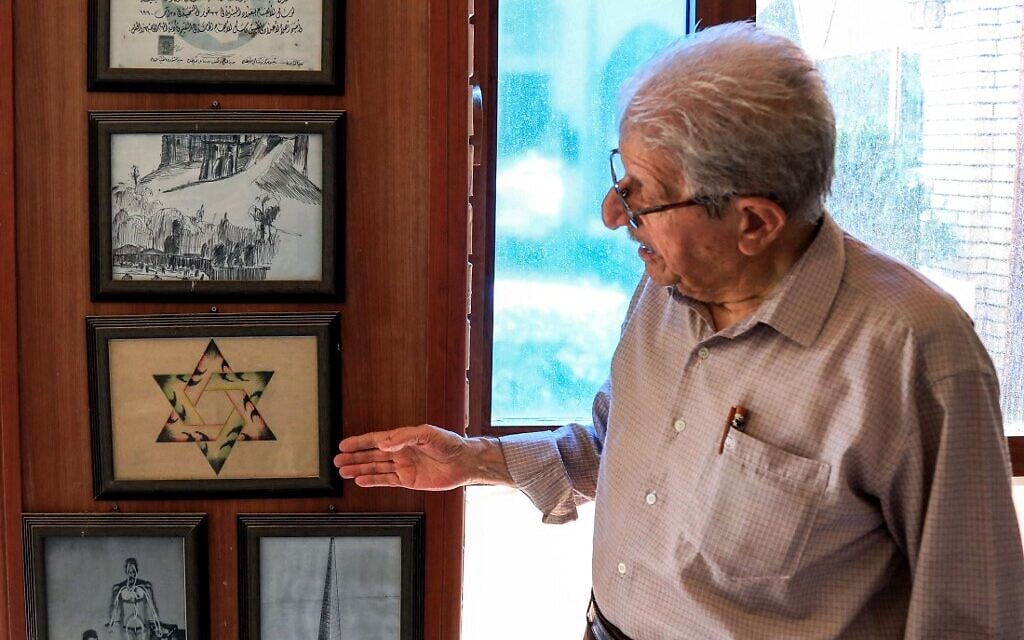Omar Farhadi, an elderly Iraqi Kurd points to a frame showing a stylized hexagram, or a Star of David, hanging in a room dedicated to famous Jewish Kurdish art teacher and painter Daniel Kassab, at the Museum of Education in Erbil's oldest primary school, in the capital of the autonomous Kurdish region of northern Iraq, on July 5, 2020. (SAFIN HAMED / AFP) Omar Farhadi, an elderly Iraqi Kurd points to a frame showing a stylized hexagram, or a Star of David, hanging in a room dedicated to famous Jewish Kurdish art teacher and painter Daniel Kassab, at the Museum of Education in Erbil's oldest primary school, in the capital of the autonomous Kurdish region of northern Iraq, on July 5, 2020. (SAFIN HAMED / AFP)