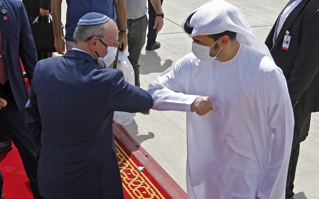 National Security Adviser Meir Ben-Shabbat elbow bumps with an Emirati official ahead of boarding the plane before leaving Abu Dhabi, United Arab Emirates, September 1, 2020. (Nir Elias/Pool/AFP) National Security Adviser Meir Ben-Shabbat elbow bumps with an Emirati official ahead of boarding the plane before leaving Abu Dhabi, United Arab Emirates, September 1, 2020. (Nir Elias/Pool/AFP)