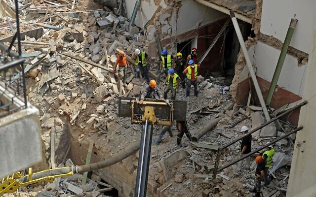Rescue workers dig through the rubble of a badly damaged building in Lebanon's capital Beirut, in search of possible survivors from the mega-blast at the adjacent port one month before; September 4, 2020. (Joseph Eid/AFP) Rescue workers dig through the rubble of a badly damaged building in Lebanon's capital Beirut, in search of possible survivors from the mega-blast at the adjacent port one month before; September 4, 2020. (Joseph Eid/AFP)