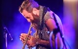 Avishai Cohen, the co-founder and artistic director of the event, performs on stage during the Jerusalem Jazz Festival in Jerusalem on September 8, 2020. (Photo by EMMANUEL DUNAND / AFP)