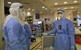 Medical staff work at the COVID-19 isolation ward of Meir Medical Center in Kfar Saba on September 9, 2020. (GIL COHEN-MAGEN / AFP)