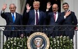 L-R: Prime Minister Benjamin Netanyahu, US President Donald Trump, Bahrain Foreign Minister Abdullatif al-Zayani, and UAE Foreign Minister Abdullah bin Zayed Al-Nahyan wave from the Truman Balcony at the White House after they participated in the signing of the Abraham Accords, where the countries of Bahrain and the United Arab Emirates recognize Israel, in Washington, DC, September 15, 2020. (SAUL LOEB / AFP)