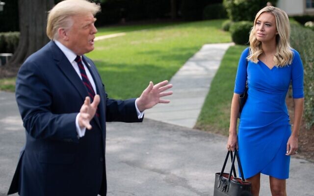 US President Donald Trump speaks alongside White House Press Secretary Kayleigh McEnany prior to departing on Marine One from the South Lawn of the White House in Washington, DC, September 15, 2020, as he travels to Philadelphia,  (SAUL LOEB / AFP)
