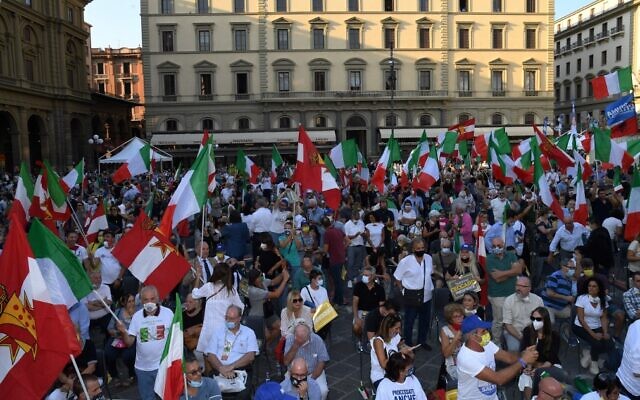 Supporters hold Italian flags during a center-right coalition rally of the Lega, Brothers of Italy and Forza Italia parties for the regional elections, on September 18, 2020, in Florence, Tuscany. (Carlo Bressan/AFP) Supporters hold Italian flags during a center-right coalition rally of the Lega, Brothers of Italy and Forza Italia parties for the regional elections, on September 18, 2020, in Florence, Tuscany. (Carlo Bressan/AFP)