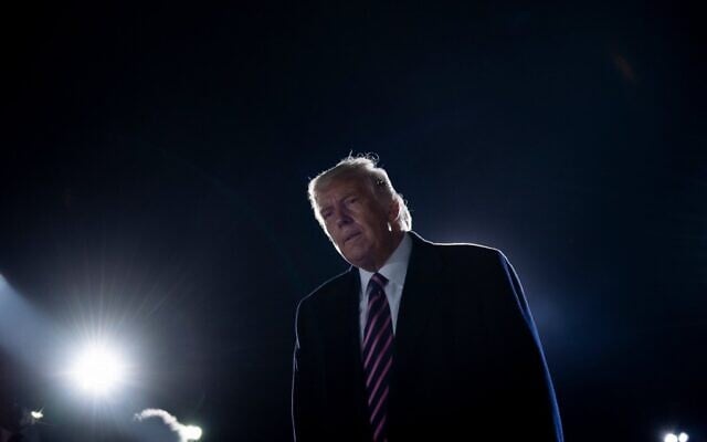 US President Donald Trump reacts to the news of the death of US Supreme Court Justice Ruth Bader Ginsburg on the tarmac of Bemidji Regional Airport after addressing supporters during a "Great American Comeback" rally at in Bemidji, Minnesota, on September 18, 2020. (Brendan Smialowski / AFP) US President Donald Trump reacts to the news of the death of US Supreme Court Justice Ruth Bader Ginsburg on the tarmac of Bemidji Regional Airport after addressing supporters during a "Great American Comeback" rally at in Bemidji, Minnesota, on September 18, 2020. (Brendan Smialowski / AFP)