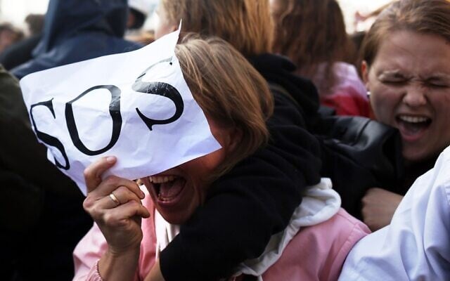 Women react during a rally to protest against the Belarus presidential election results in Minsk on September 19, 2020. (TUT.BY / AFP) Women react during a rally to protest against the Belarus presidential election results in Minsk on September 19, 2020. (TUT.BY / AFP)