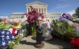 A bobblehead of Ruth Bader Ginsburg is left outside of the US Supreme Court in Washington on September 19, 2020. (Jose Luis Magana/AFP)
