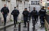Illustrative: French police officers rush to the scene of a suspected terror attack in Paris, on September 25, 2020. (Alain Jocard/AFP)