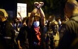 Israeli protesters gather during a demonstration amid a second lockdown in front of Prime Minister Benjamin Netanyahu's residence in Jerusalem, on September 26, 2020, to protest the government's handling of the COVID-19 pandemic. (Emmanuel DUNAND / AFP)