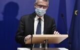 Anti-terrorism state prosecutor Jean-Francois Ricard wearing a face mask speaks during a press conference on September 29, 2020, after a man armed with a knife seriously wounded two people on September 25, 2020, in a suspected terror attack outside the former offices of French satirical weekly Charlie Hebdo in Paris. (Photo by STEPHANE DE SAKUTIN / AFP)
