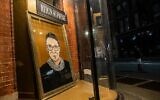 A portrait of US Supreme Court Justice Ruth Bader Ginsburg is displayed at a storefront on September 19, 2020, in New York, New York. (Jeenah Moon/Getty Images/AFP)