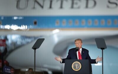 US President Donald Trump speaks to supporters at a rally with Air Force One in the background on September 10, 2020 in Freeland, Michigan. (Scott Olson/Getty Images/AFP)