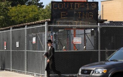 Illustrative: A man walk by a COVID-19 testing site in the Brooklyn neighborhood of Borough Park on September 23, 2020 in New York City. (Spencer Platt/Getty Images/AFP)