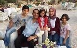 This undated 2018 photo shows Dr. Mohammed Ayesh and his family in Gaza. (Ayesh family via AP)