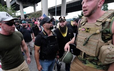 Proud Boys wait to get into vehicles after marching across the Hawthorne Bridge in Portland, Oregon, Aug. 17, 2019. (Alex Milan Tracy/Anadolu Agency via Getty Images, JTA)