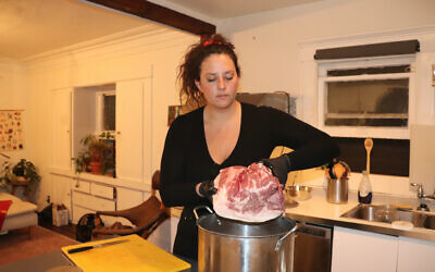 It takes 10 days for Rebecca King to brine the meat for her pork sandwiches. (Josefin Dolsten/ JTA)