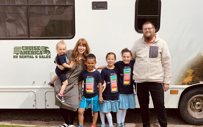Chaim and Chavie Bruk, seen here with four of their five children, didn't know anyone who had adopted in the Orthodox community when they started building a family. (Courtesy of the Bruk family/ via JTA)