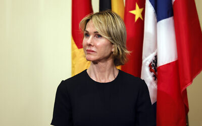US Ambassador to the United Nations Kelly Craft  listens as Secretary of State Mike Pompeo speaks to reporters following a meeting with members of the UN Security Council, Thursday, Aug. 20, 2020, at the United Nations. (Mike Segar/Pool via AP)
