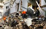 Chilean and Lebanese rescuers search in the rubble of a building that was collapsed in last month's massive explosion,  after getting signals there may be a survivor under the rubble, in Beirut, Lebanon on September 3, 2020. (AP/Bilal Hussein)