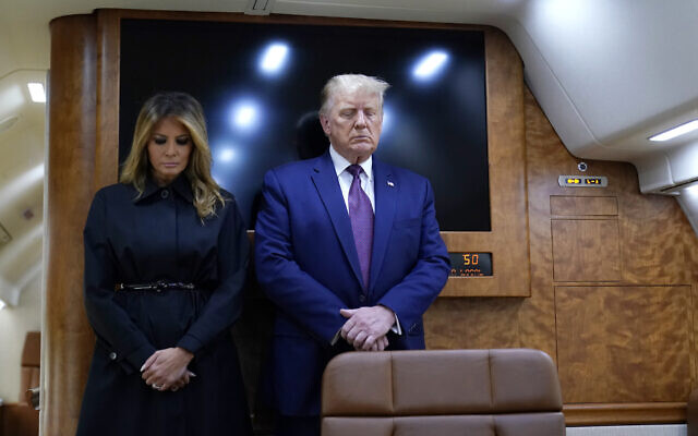 US President Donald Trump and first lady Melania Trump pause for a moment of silence on Air Force One as he arrives at the airport in Johnstown, Pennsylvania, on his way to speak at the Flight 93 National Memorial, September 11, 2020, in Shanksville, Pennsylvania. (AP Photo/Alex Brandon) US President Donald Trump and first lady Melania Trump pause for a moment of silence on Air Force One as he arrives at the airport in Johnstown, Pennsylvania, on his way to speak at the Flight 93 National Memorial, September 11, 2020, in Shanksville, Pennsylvania. (AP Photo/Alex Brandon)