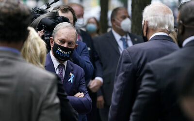 Former New York mayor Michael Bloomberg, left, visits with Democratic presidential candidate Joe Biden, at the National September 11 Memorial in New York, September 11, 2020, before a ceremony marking the 19th anniversary of the terrorist attacks. (AP Photo/Patrick Semansky)