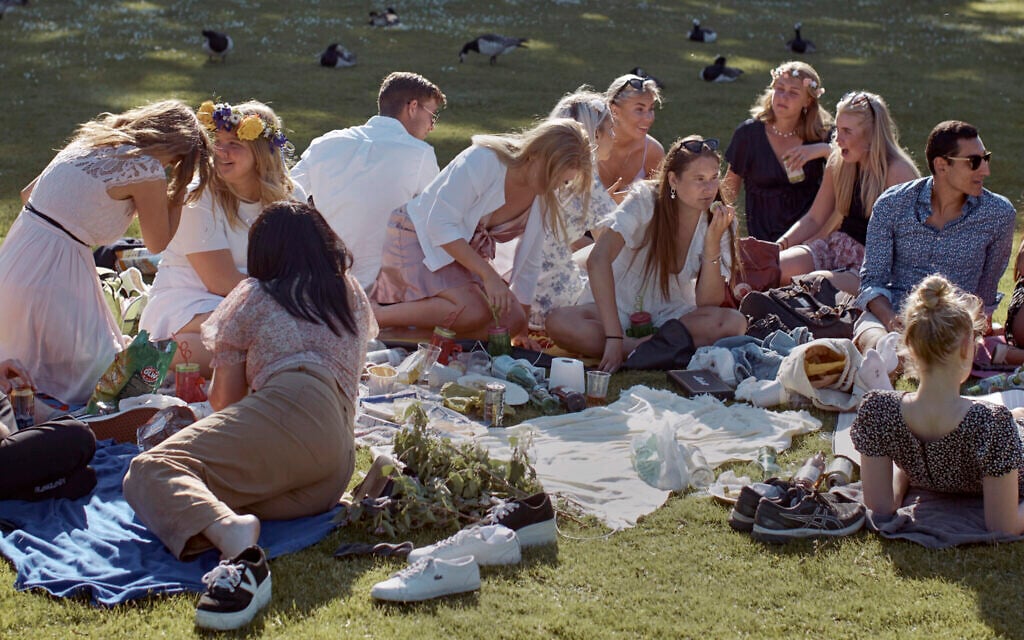 People picnic during the annual Midsummer celebrations in Stockholm, Sweden, June 19, 2020. (AP Photo/Andres Kudacki, File) People picnic during the annual Midsummer celebrations in Stockholm, Sweden, June 19, 2020. (AP Photo/Andres Kudacki, File)