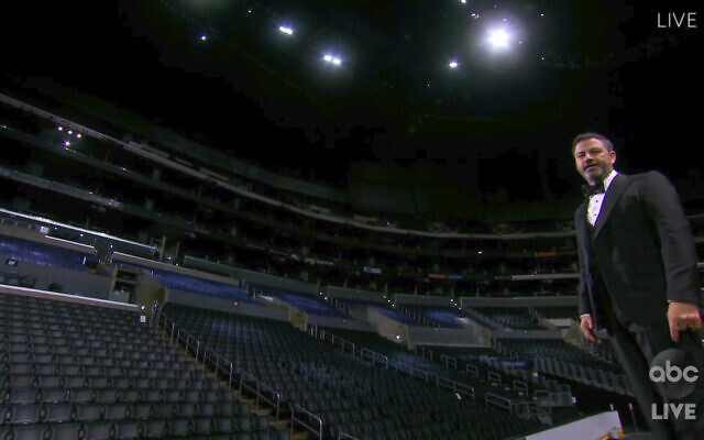 In this video grab captured on Sept. 20, 2020, courtesy of the Academy of Television Arts & Sciences and ABC Entertainment, host Jimmy Kimmel speaks on stage in front of empty seats during the 72nd Emmy Awards broadcast. (The Television Academy and ABC Entertainment via AP)