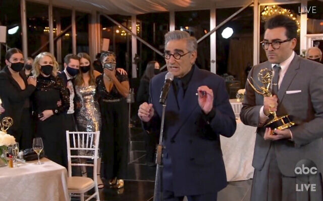 In this video grab captured on Sept. 20, 2020, courtesy of the Academy of Television Arts & Sciences and ABC Entertainment, Annie Murphy, from left, Catherine O'Hara, Noah Reid, Sarah Levy, Karen Robinson, Eugene Levy and Daniel Levy accept the award for outstanding comedy series for "Schitt's Creek" during the 72nd Emmy Awards broadcast. (The Television Academy and ABC Entertainment via AP)