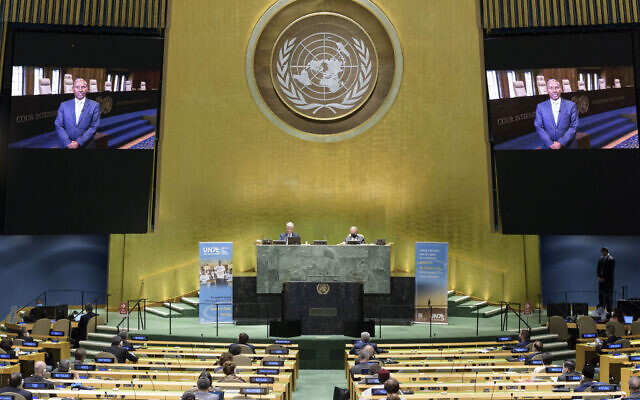 In this photo provided by the United Nations, President of the International Court of Justice, Judge Abdulqawi Ahmed Yusuf, is seen on screens as he addresses the United Nations General Assembly to commemorate the 75th anniversary of the United Nations, September 21, 2020 (Manuel Elías/United Nations via AP) In this photo provided by the United Nations, President of the International Court of Justice, Judge Abdulqawi Ahmed Yusuf, is seen on screens as he addresses the United Nations General Assembly to commemorate the 75th anniversary of the United Nations, September 21, 2020 (Manuel Elías/United Nations via AP)