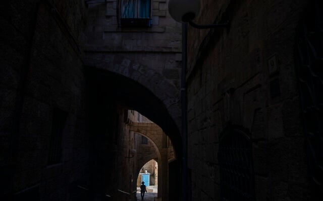 An Ultra-Orthodox Jewish man walks toward the Western Wall, the holiest site where Jews can pray in Jerusalem's Old City ahead of Yom Kippur, September 27, 2020. (AP Photo/Ariel Schalit) An Ultra-Orthodox Jewish man walks toward the Western Wall, the holiest site where Jews can pray in Jerusalem's Old City ahead of Yom Kippur, September 27, 2020. (AP Photo/Ariel Schalit)